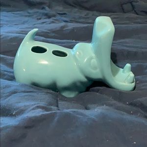 Ceramic hippo toothbrush & toothpaste holder.